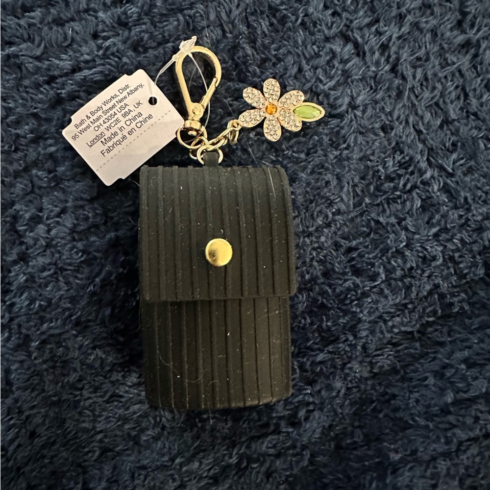Bath & Body Works Black and Gold PocketBac holder with Flower Charm